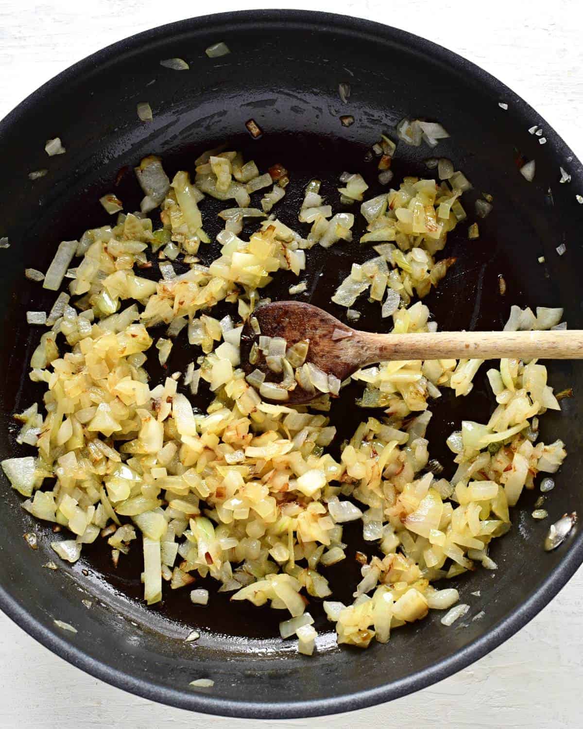 frying onion in a pan