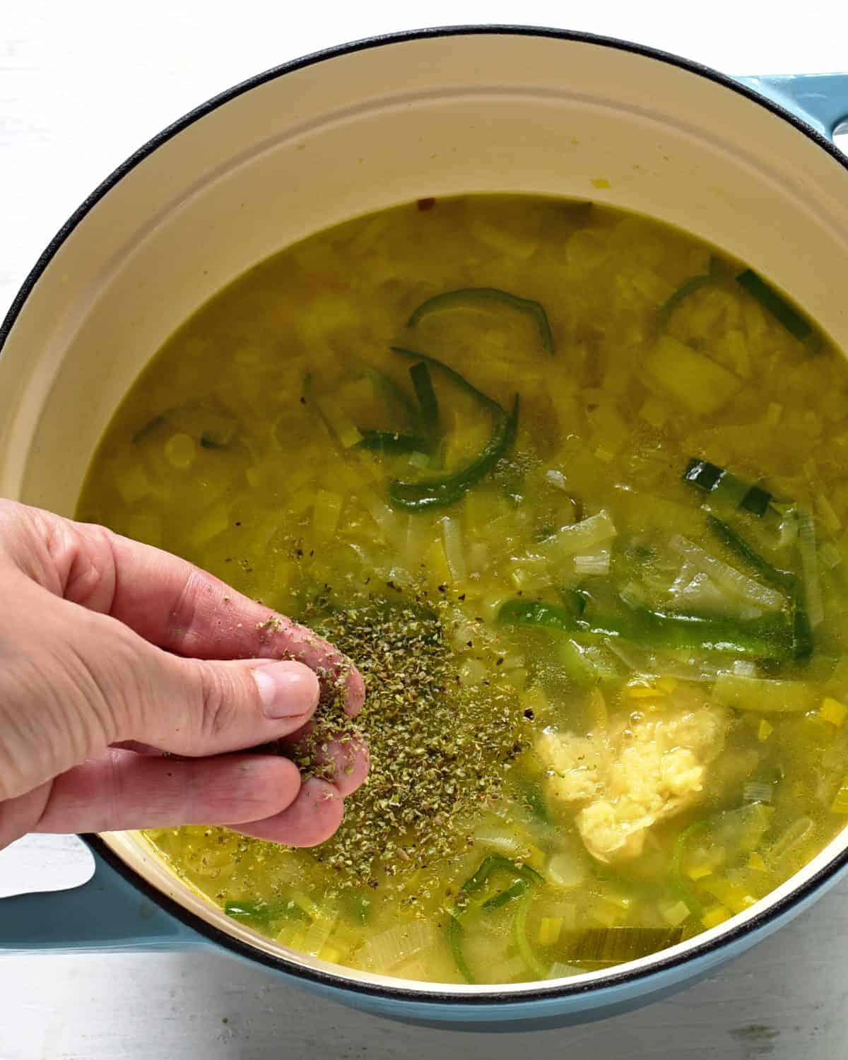 adding driend marjoram to a leek soup