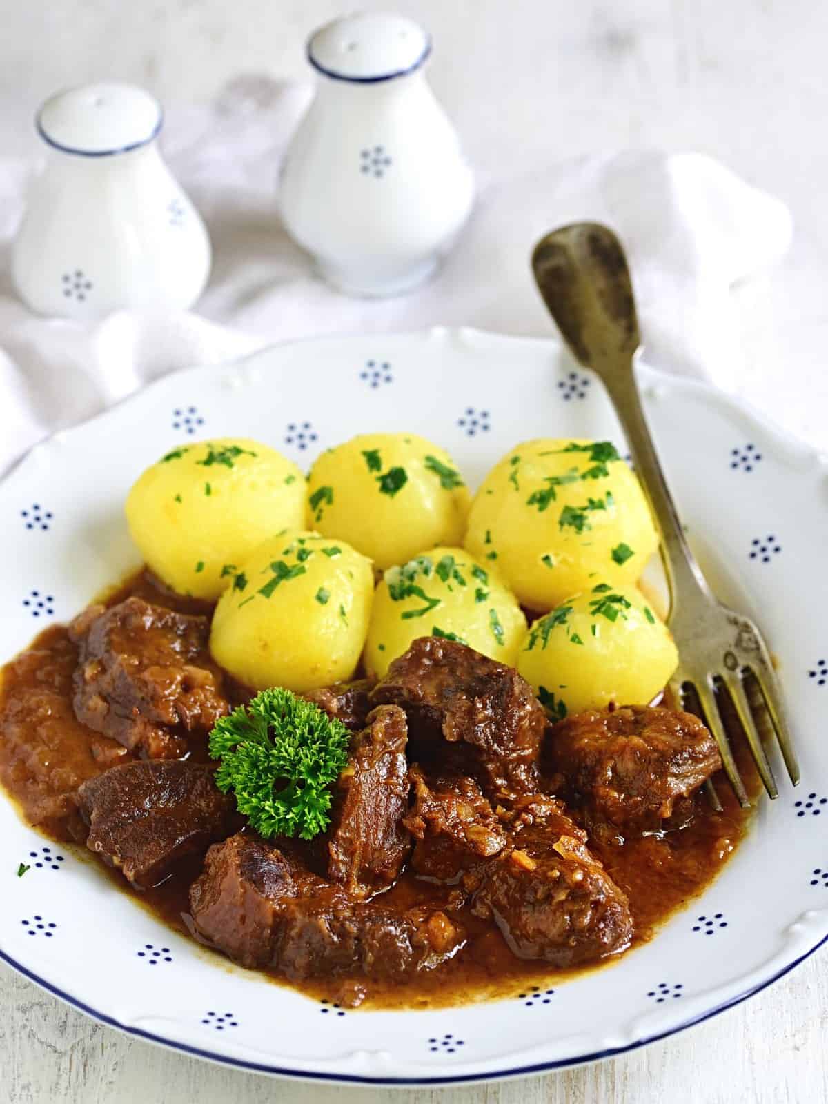 Austrian Goulash with Potatoes serven on a plate.
