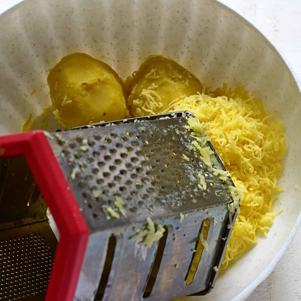 Grating potatoes.