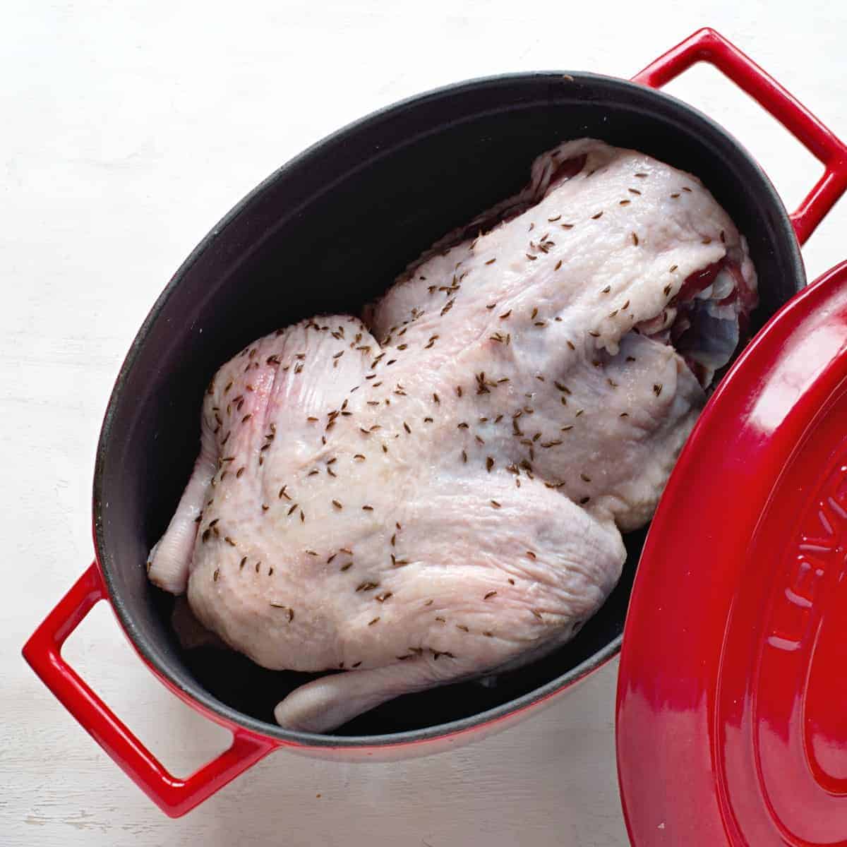 Duck roast in an iron roasting dish. 
